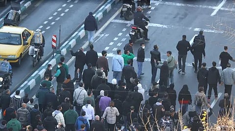 Iranians protest in Tehran as clashes grip country’s west