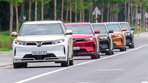 VINFAST electric vehicles drive in formation during a regional activity as the brand expands its presence and service network in Southeast Asia.