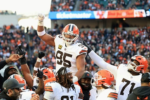 CLEECVELAND Browns defensive end Myles Garrett, center, celebrates after breaking the NFL single-season quarterback sacks record in a victory over Cincinnati