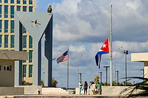 The Cuban national flag flies at half-mast outside the US Embassy in Havana on January 5, 2026. Havana declared two days of national mourning as of January 5 after a total of 32 Cubans were killed during the US attack on Caracas that culminated in the capture of Venezuela's president Nicolas Maduro.