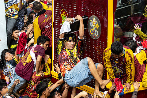 A crowd estimate by late afternoon Friday of over 600,000 Catholic devotees is seen to have filled the streets of Manila for the procession of the carriage or andas carrying the image of the Black Nazarene during the annual religious procession or Traslacion on 9 January.