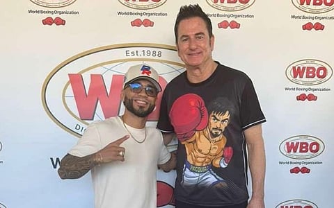WBO and WBA champion Oscar Collazo (left) and American boxing man Sean Gibbons pose during a WBO event over the weekend in Puerto Rico.