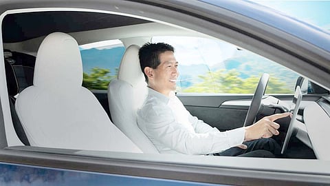 DRIVER interacts with an advanced in-car display as Texas Instruments positions its automotive chips for higher levels of vehicle automation.