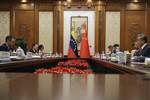 Chinese Foreign Minister Wang Yi (R) and Venezuela's Foreign Minister Yvan Gil (L) attend a meeting at the Diaoyutai State Guesthouse in Beijing on May 12, 2025.
