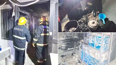 MEMBERS of the Bureau of Fire Protection in Baguio City checks on the damage caused by the fire that hit a residential area due to an LPG tank flaring at a kitchen in the house. Fire out was declared within 14 minutes after the distress call was made.