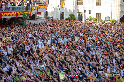 UNWAVERING faith Devotees raise their treasured Santo Niños during the Sinulog celebration in Cebu on Sunday, echoing the original icon (inset) — a living tide of faith, thanksgiving and prayer.