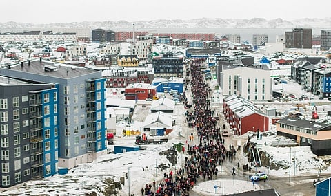PEOPLE take part in a demonstration that gathered almost a third of the city's population to protest against the US president’s plans to take Greenland, in Nuuk on 17 January 2026.