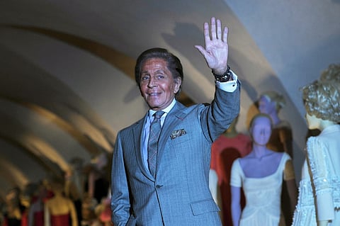 (FILES) Italian couturier Valentino Garavani poses for photographs at the launch of his exhibition 'Valentino: Master of Couture' at Somerset House in central London on November 28, 2012. The exhibition marks 50 years of Valentino's creations and features more than 130 of the Italian designers gowns. Italian designer Valentino Garavani, whose luxurious dresses adorned some of the world's most elegant women from Jackie Kennedy to Audrey Hepburn, has died aged 93, his foundation said on January 19, 2026.