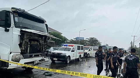 AUTHORITIES inspect the passenger jeepney that was crushed by a dump truck at a highway in Isabela province which saw three people dead and scores injured.