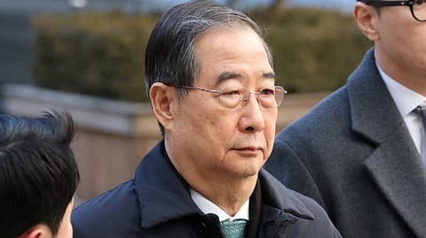 FORMER South Korean Prime Minister Han Duck-soo (right) arrives at the Seoul Central District Court for his first sentencing trial in the insurrection case in Seoul on 21 January 2026.