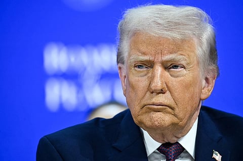 US President Donald Trump reacts at the "Board of Peace" meeting during the World Economic Forum (WEF) annual meeting in Davos on January 22, 2026. US President Donald Trump will show off his new "Board of Peace" at Davos on January 22, 2026 burnishing his claim to be a peacemaker a day after backing off his own threats against Greenland. Originally meant to oversee the rebuilding of Gaza after the war between Hamas and Israel, the board's charter does not limit its role to the Strip, and has sparked concerns that Trump wants it to rival the United Nations.