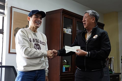 Manila Mayor Isko Moreno Domagoso hands over to PLM President Atty. Domingo Y. "Sonny" Reyes Jr. the check amounting to P117.5 million city subsidy to the school. Courtesy of Manila City hall