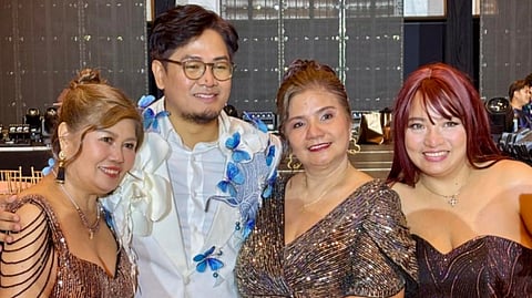 JUAN World Philippines general manager Jake Acasio Mendoza (second from left) poses with awardee Soledad 'Bheng' Gagui (right).