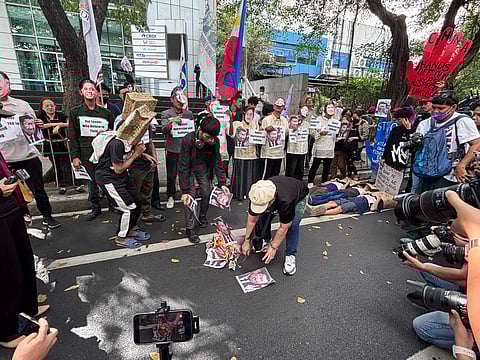 Different groups staged a die-in Infront of Chinese embassy to protest bullying at WPS