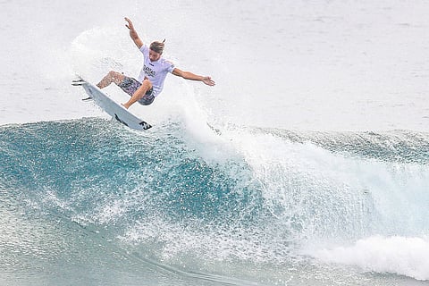 WHERE waves write their own invitations A surfer rides the curling crest off Siargao’s coast, poised between sky and sea — a fitting emblem of journeys made lighter, as lower airfares carry more dreamers toward the island.