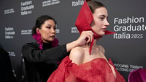 FASHION designer Hannah Barrera with a model.