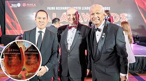 PRIME movers of the Paeng Hechanova Youth Leadership Awards, trophies for which are shown in the inset, are (from left) Gala Night chairperson Michael del Carmen, past district governor Sid Garcia, and Daily Tribune columnist and past Rotary Club of Makati president Bing Matoto.