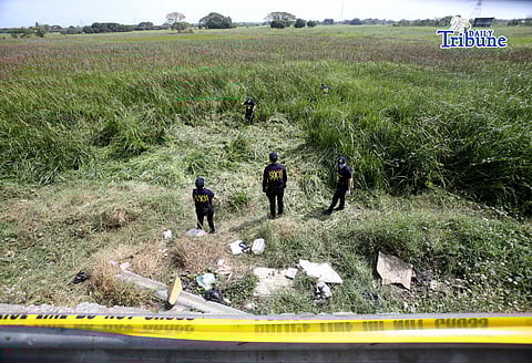 (FILE) SCENE of the Crime Operatives SOCO use a metal detector searching of the allegedly firearm used for the killing of Senior Master Sergeant Diane Marie Mollenido and her son, along the Pulilan–Baliuag Bypass Road on Saturday January 31 2026, one of the arrested suspect said they threw the gun use in the killing into the ditch. The victim assigned to the National Capital Region Police Office (NCRPO), was found dead in Pulilan, Bulacan, on Saturday—five days after she and her eight-year-old son were reported missing. (January 31 2026)