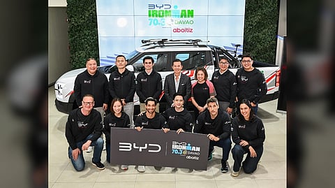 TEAM members from BYD Cars Philippines, ACMobility, and Sunrise Events pose with the official IRONMAN 70.3 Davao signage during the partnership announcement at BYD Manila Bay. Shown are (from left): Bob Palanca, managing director, BYD Cars Philippines; Adam Hu, country head, BYD Philippines; Jaime Alfonso Zobel de Ayala, CEO, ACMobility; Dino Obias, chief marketing officer, ACMobility, and Fred Uytengsu and Princess Galura of Sunrise Events are joined by the The BYD Triathlon Teams as represented by Jens Jacobsen (Bike), Jas Alkhadi (Swim), and Jennifer Uy (Run), and the BYD Celebrity Triathlon Team, Nico Bolzico (Run), Alden Richards (Bike) and Wil Dasovich (Swim) alongside their coach, Al Gonzalez.