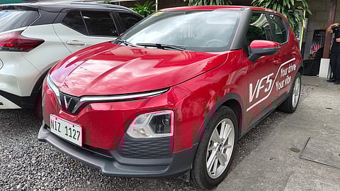 RED VinFast VF5 is shown during a local event as the brand outlines its battery subscription option that lowers upfront ownership costs.