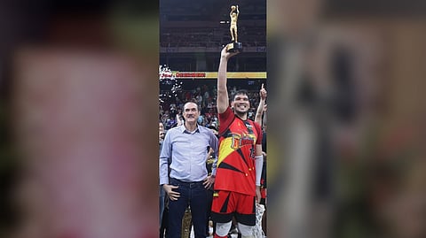 JUNE Mar Fajardo lifts the Finals Most Valuable Player trophy named after his boyhood mentor, Ramon Fernandez, following San Miguel’s 92-77 conquest of TNT Tropang 5G in Game 6 of their PBA Philippine Cup best-of-seven finals series.