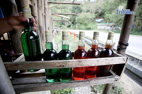 Owner of sari-sari store arranges her selling colorful fuel, which is placed in the battle display along the street in Tanay, Rizal. Motorists can expect another oil price hike as February opens, with Gasoline - P0.80 per liter, Diesel – P1.60 per liter, Kerosene – P1.10 per liter the Department of Energy (DOE) said.