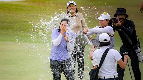 CHING Huang soaks in the celebrations after her victory at the ICTSI Philippine Ladies Masters at Summit Point on Friday.
