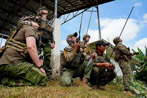 SIMULATION Combat air controllers from the Philippine Air Force and their American counterparts synchronize air-to-ground operations during the US-Philippine Live Drop exercise at Colonel Ernesto Rabina Air Base in Tarlac City.