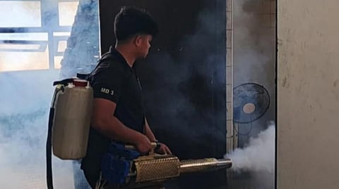 THE Manila City Disaster Risk Reduction and Management Department Operations Team conducts fogging at the Bureau of Fire Protection Sta. Ana office, part of heightened efforts to curb a potential rise in dengue cases.