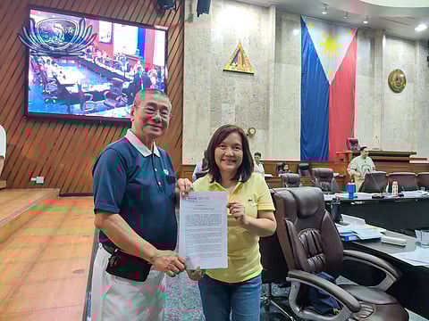 TZU Chi Medical Foundation Philippines CEO Alfredo Li receives from Councilor Nanette Daza a copy of the Quezon City Council resolution commending the humanitarian organization for providing free medical services to eye patients at its high-tech clinic.