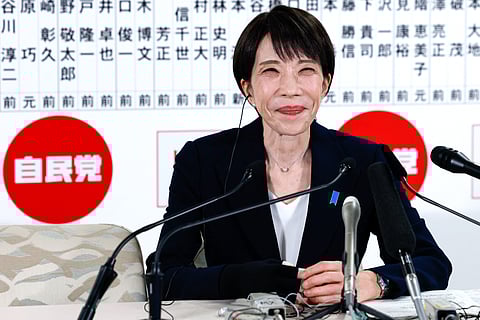 Japan's Prime Minister and President of the Liberal Democratic Party (LDP) Sanae Takaichi reacts as she speaks with media on the House of Representatives election day at the LDP headquarters in Tokyo on February 8, 2026.