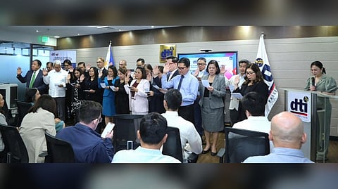 TRADE Secretary Cristina Roque (right) swears in Supply Chain and Logistics Center’s new partners, on Wednesday at the DTI office in Makati City.