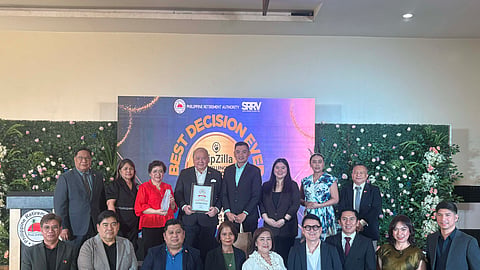 Officials of the Philippine Retirement Authority led by General Manager and CEO Roberto Z. Zozobrado and Deputy General Manager Atty. Maria Milagros R. Lisaca receive the Best Retirement Destination in Asia award from TripZilla. Photo taken by Mico Virata for DAILY TRIBUNE