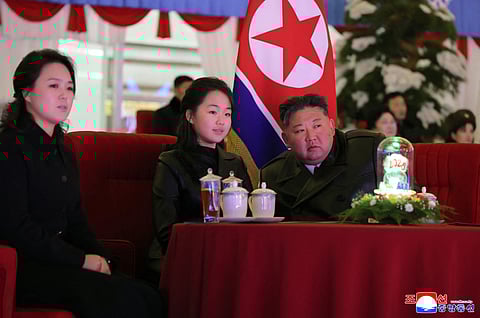 (FILES) This picture taken on December 31, 2025 and released by North Korea's official Korean Central News Agency (KCNA) via KNS on January 1, 2026 shows North Korean leader Kim Jong Un, his daughter Kim Ju Ae (C) and wife Ri Sol Ju (L) watching a New Year's celebration performance at the May Day Stadium in Pyongyang. North Korean leader Kim Jong Un has entrenched his daughter as heir apparent ahead of a landmark party conference, a South Korean lawmaker said on February 12, 2026 after a briefing from Seoul's main intelligence agency.