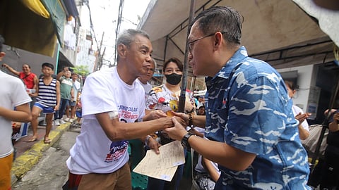Sen. Bong Go visits Barangay 580 in Sampaloc, Manila following a recent fire, providing aid to 33 affected families and citing key fire safety and evacuation center laws he authored.
