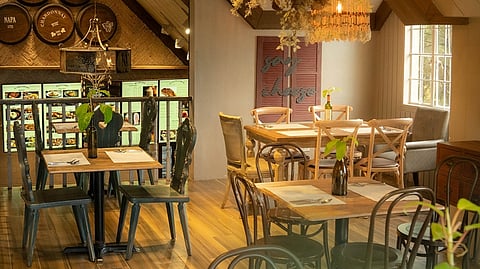 INSIDE NAPA, the inviting interior features wooden accents, softly glowing chandeliers, barrels, and wall decorations that perfectly complement the restaurant’s vibe, setting that romantic mood.