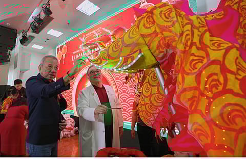 CSMC CEO and A Raul Pagdanganan (left) and CSMC vice president and chief medical officer Dr. Antonio Say do the ceremonial dotting of the dragon’s eye.