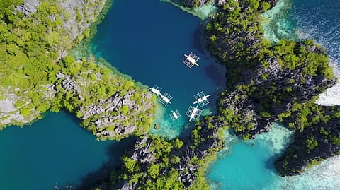 AN aerial view shows the karst limestone formations and clear blue lagoons of El Nido, Palawan.