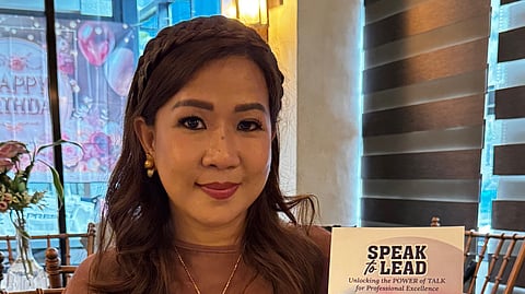 Author Dang Bernardez with her book Speak to Lead