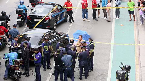 SCENE-of-crime operatives examine the portion of EDSA, below the northbound platform of the LRT Fernando Poe Jr. Station in Muñoz, Quezon City, where a male jumped, on 11 February 2026.