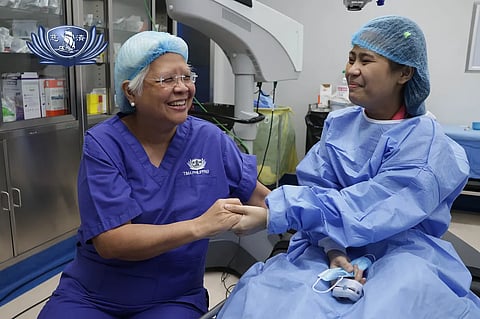 JENMEL Arambulo (right) is filled with joy after Dr. Bernardita Navarro, medical director of Tzu Chi Eye Center, surgically removed the cataract on her right eye.