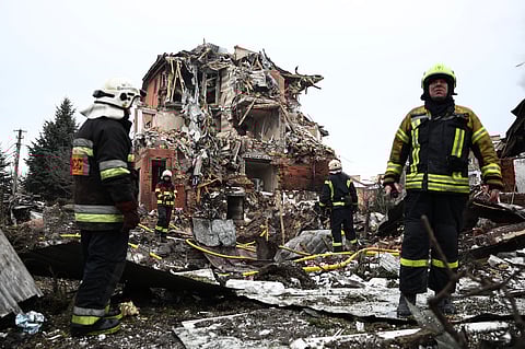 UKRAINIAN rescuers work at the site of a heavily damaged house following an air attack in Sofiivska Borshchagivka, Kyiv region on 22 February 2026, amid the Russian invasion of Ukraine.