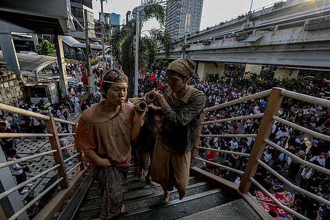 Members of the UP Repertory Company are seen to depict "taong putik" that signifies a protest for the alleged "floodgate scandal" in the Philippines. The street performance is a continues effort to spread the message about anomalies that started on the September 21, 2025 protest. Aram Lascano