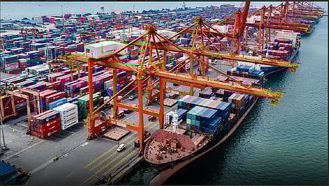 Shipping containers line the docks at a terminal managed by International Container Terminal Services Inc.