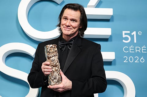 Canadian actor Jim Carrey who received a honorary Cesar award poses with his trophy during the 51st edition of the Cesar Film Awards ceremony at the Olympia venue in Paris on 26 February 2026.
