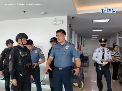 AUTHORITIES from the Quezon City Police District conduct sweep of Hall of Justice after bomb threat report this Friday.