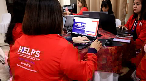 Officers from the Department of Social Welfare and Development's Standards Bureau conducting a road show to discuss the process of its Harmonized Electronic License and Permit System (HELPS) program last December of 2024.