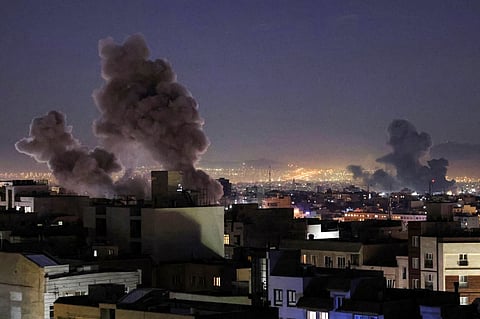 Smoke plumes rise following missile strikes in Tehran on 1 March, 2026. The United States and Israel launched strikes against Iran on 28 February, killing Iran's supreme leader and top military leaders, prompting authorities to retaliate with strikes on Israel and US bases across the Gulf.