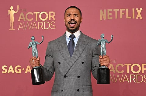 US actor Michael B. Jordan poses with the awards for Outstanding Performance by a Male Actor in a Leading Role and Outstanding Performance by a Cast in a Motion Picture for "Sinners" during the 32nd Annual Actor Awards at the Shrine Auditorium in Los Angeles on 1 March, 2026.