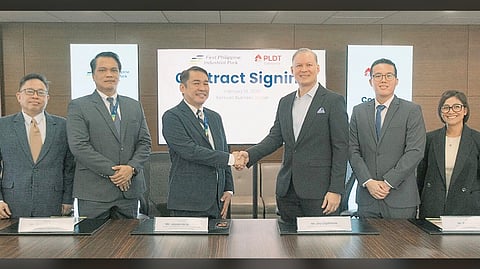 JASON de las Alas (3rd from left), assistant vice president and head of Park & Utilities Group of First Philippine Industrial Park, and Jay Lagdameo (4th from left), vice president and head of Enterprise Domestic Business at PLDT Enterprise, shake hands during the renewal of their companies’ partnership to strengthen digital infrastructure for industrial locators in Batangas.